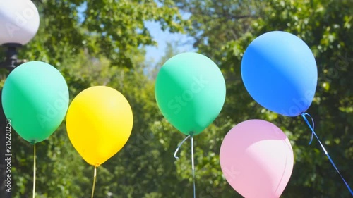 Multi-colored balloons in the wind