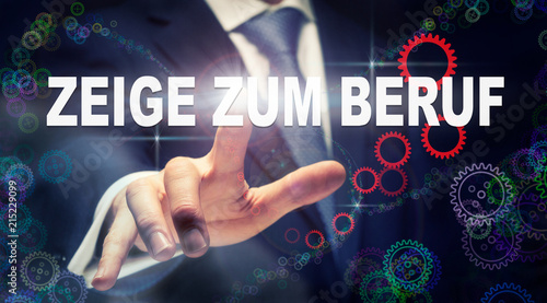A businessman pressing a Way To Work "Zeige Zum Beruf" button in German on a futuristic computer display