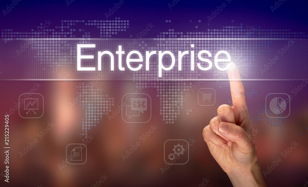 A hand selecting a Enterprise business concept on a clear screen with a colorful blurred background. A hand selecting a Enterprise business concept on a clear screen with a colorful blurred background.