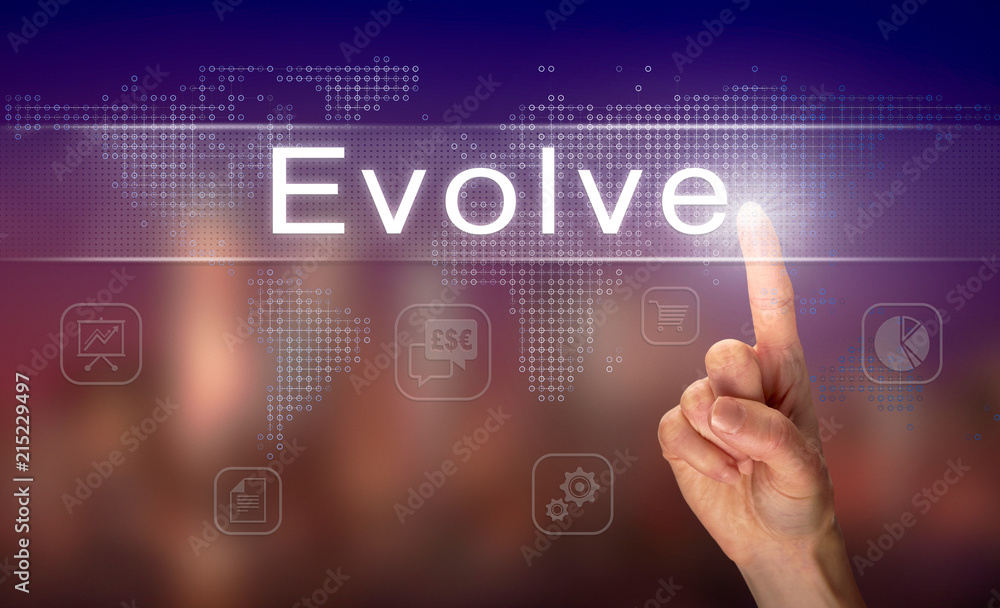 A hand selecting a Evolve business concept on a clear screen with a colorful blurred background. A hand selecting a Evolve business concept on a clear screen with a colorful blurred background.