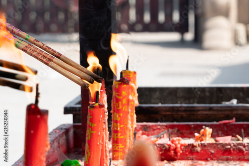 SHANGHAI,CHINA - JUN 2018: Longhua temple in Shanghai, China. lighting the candle to pray to Buddha photo