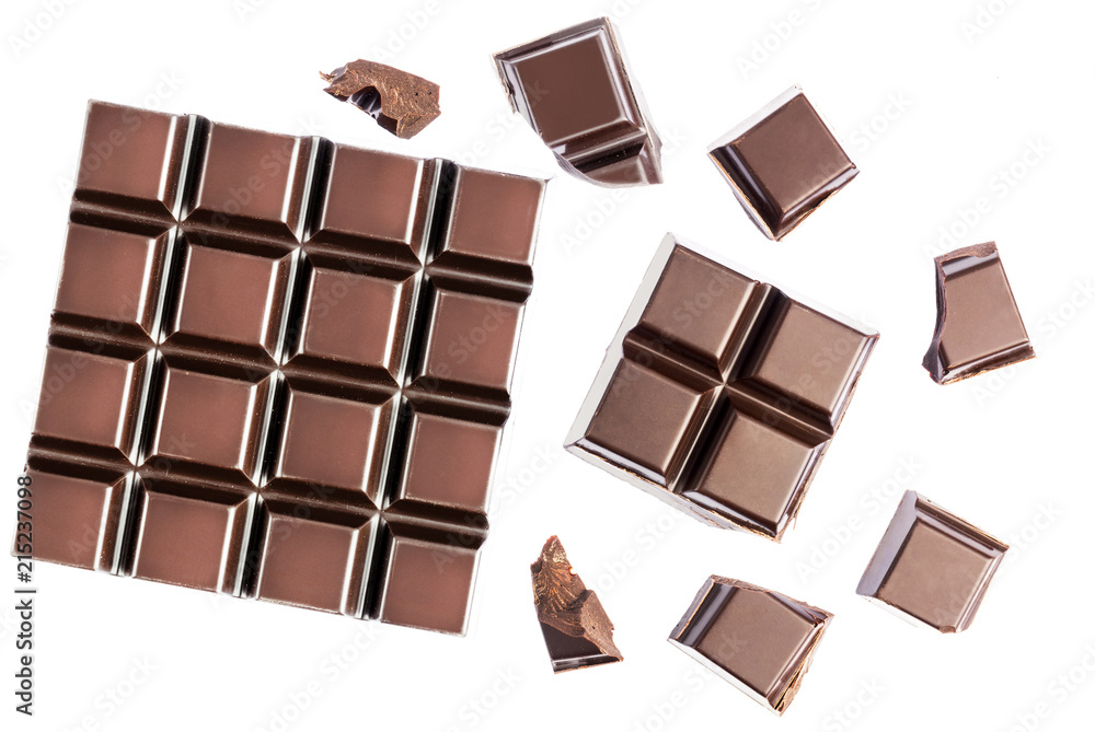 Fototapeta premium Chocolate cubes, pieces of bitter, dark chocolate bar, isolated on white background, top view