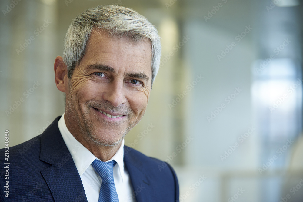 Close-up of businessman smiling Close-up of businessman smiling