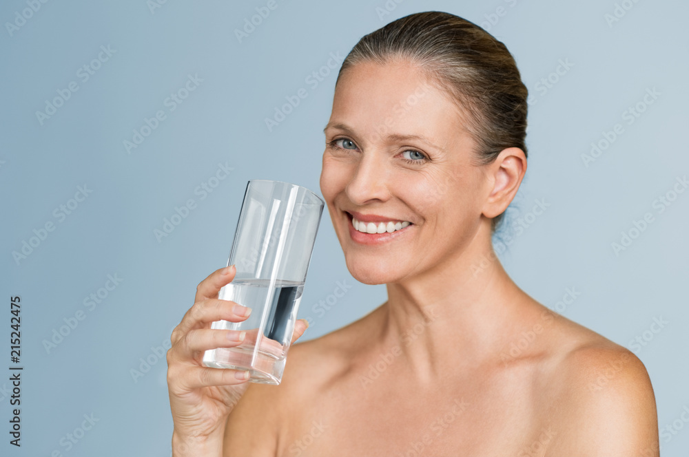 Mature woman drinking water Mature woman drinking water