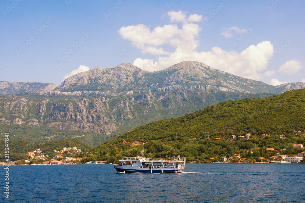 Summer Mediterranean landscape with pleasure boat.  Montenegro, Bay of Kotor, Adriatic Sea