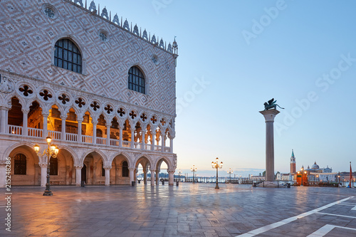 San Marco square with Doge palace and column with lion statue, nobody at sunrise in Venice, Italy