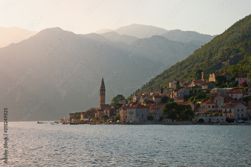 Beautiful evening Mediterranean landscape. Montenegro, Bay of Kotor, Adriatic Sea. View of ancient town of Perast  with bell tower of church of St. Nicholas