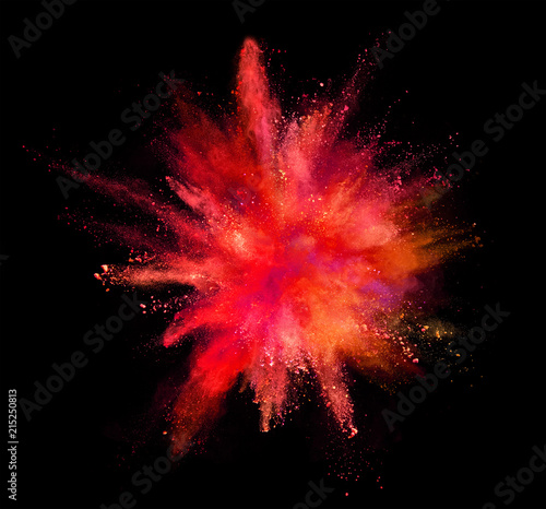 Coloured powder explosion isolated on black background