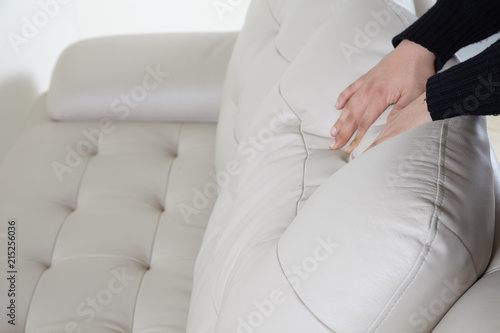 hands on a leather cushion