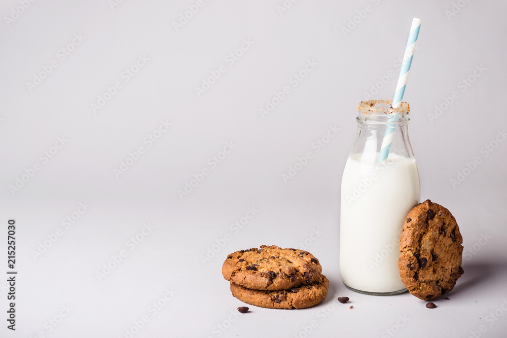 bottle of milk is decorated with cookies crumbs and chocolate chip cookies bottle of milk is decorated with cookies crumbs and chocolate chip cookies