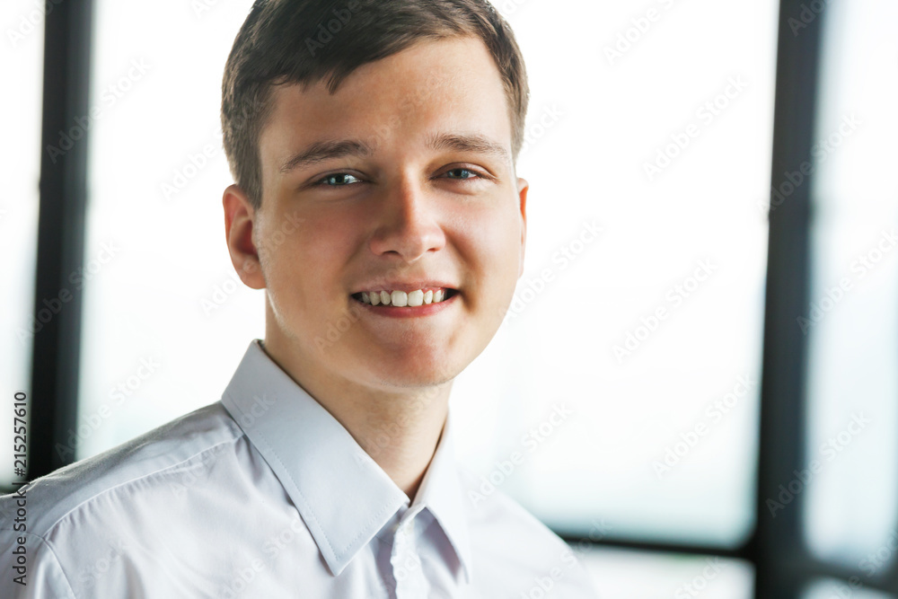 Portrait of young business man looking at camera. Portrait of young business man looking at camera.