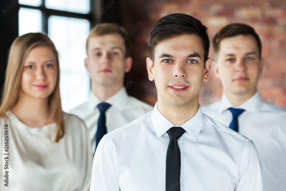 Portrait of young business people looking at camera. Portrait of young business people looking at camera.