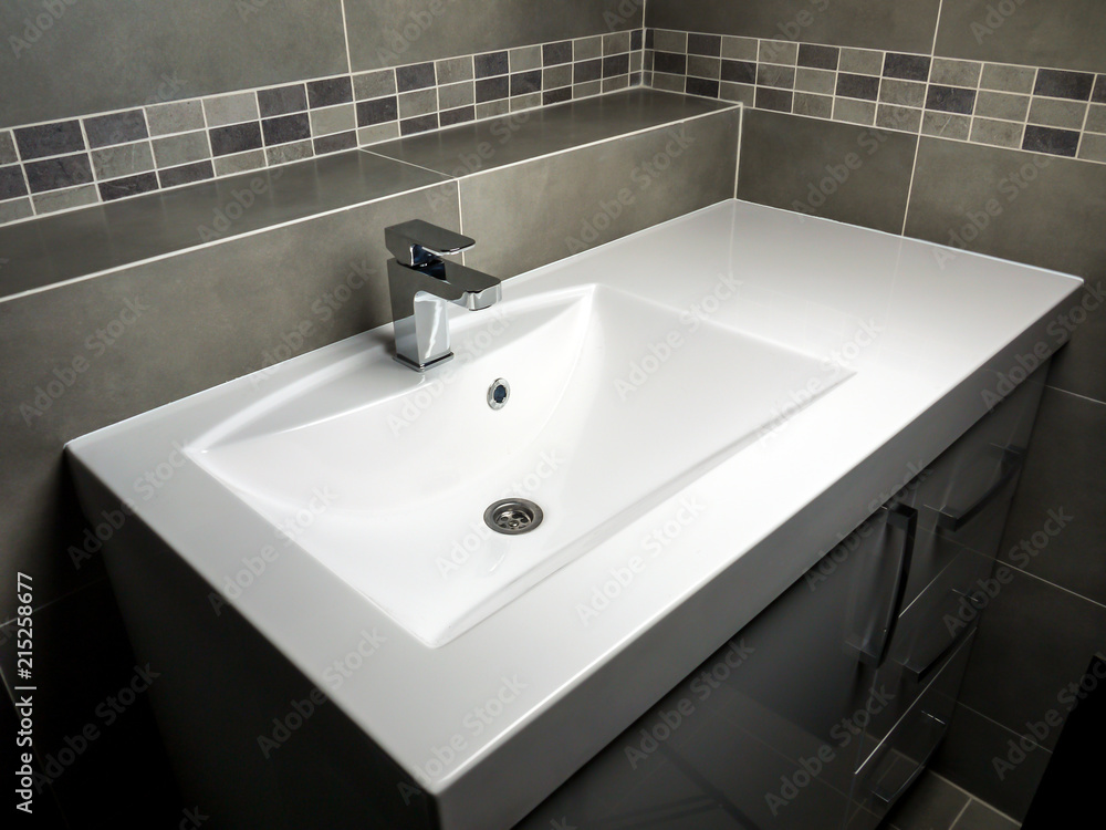 Fototapeta premium White washbasin with chrome faucet