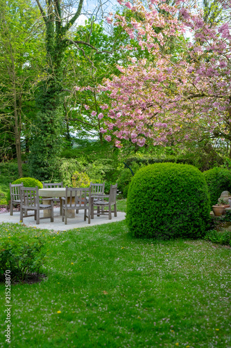 beautiful garden with table and chairs