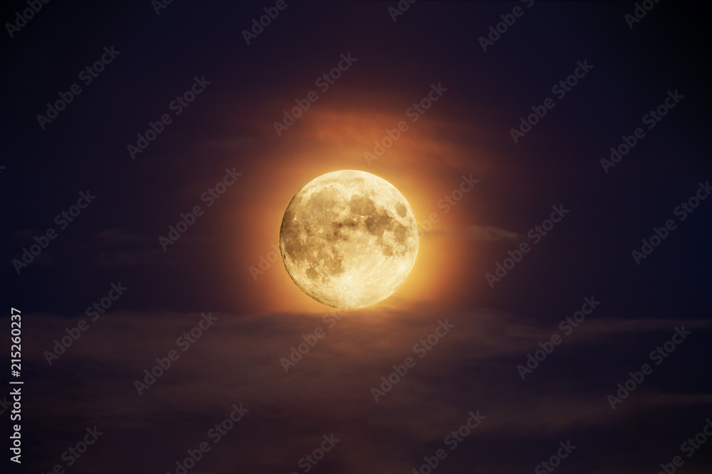 Bright full moon against dark clouds vibrant colors Bright full moon against dark clouds vibrant colors