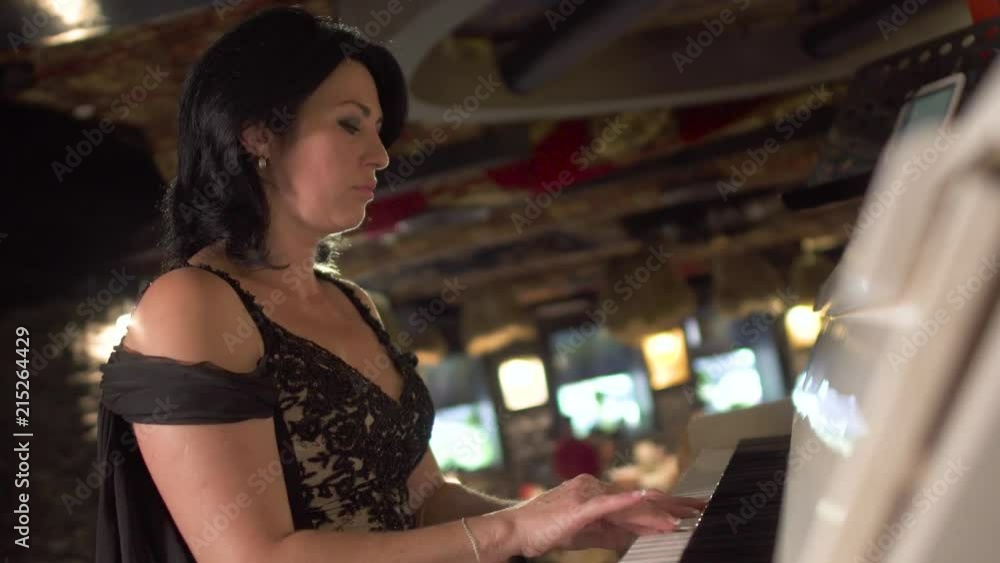 Adult lady plays piano Adult lady plays piano