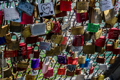 Padlocks on the bridge fence. © vitalim