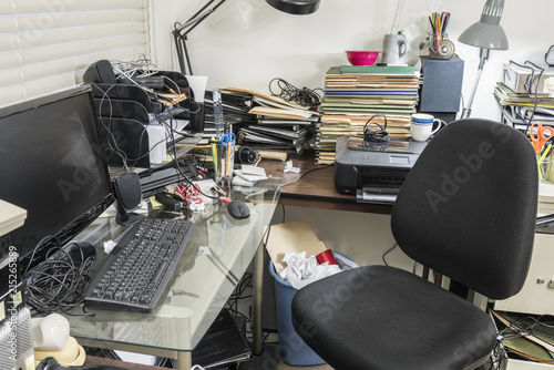 Messy office with clutter f...