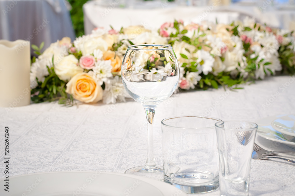 Wedding banquet tables preparing for a wedding outside on a summer day Wedding banquet tables preparing for a wedding outside on a summer day
