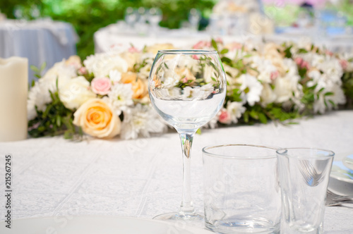 Wedding banquet tables preparing for a wedding outside on a summer day