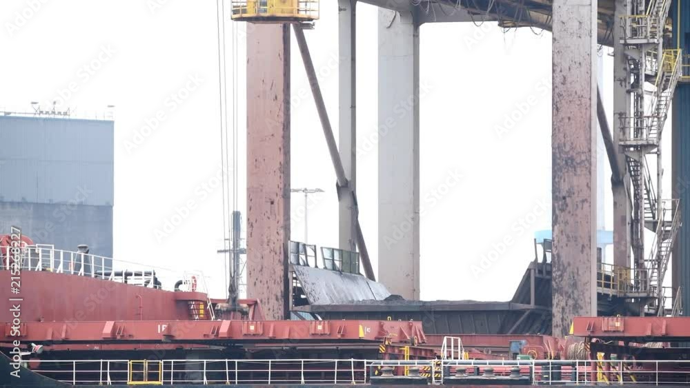 Coal cargo ship unloading at the coal terminal Coal cargo ship unloading at the coal terminal
