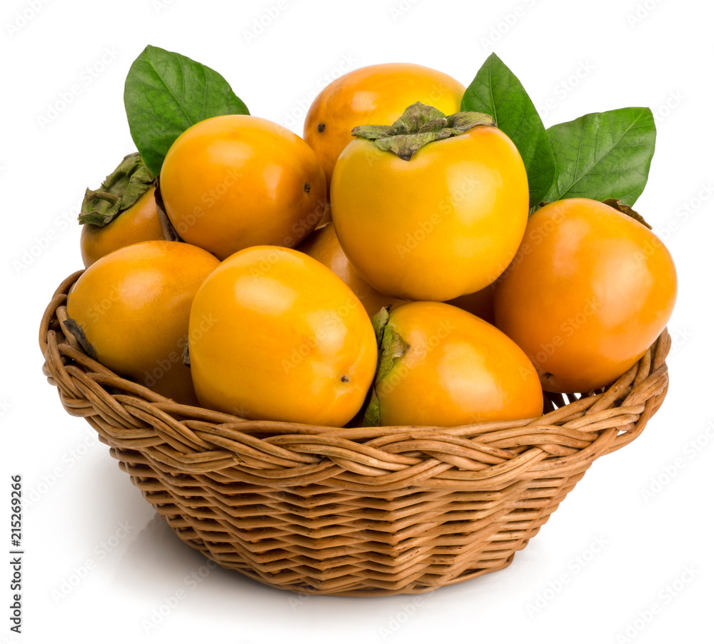 persimmons in basket on white background