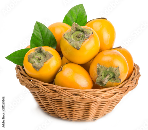 persimmons in basket on white background