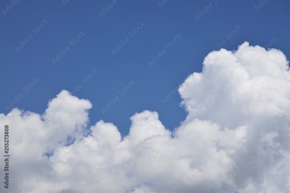 Amazing cumulonimbus clouds and sunlight on the background of clear blue sky, Summer in GA USA. Amazing cumulonimbus clouds and sunlight on the background of clear blue sky, Summer in GA USA.
