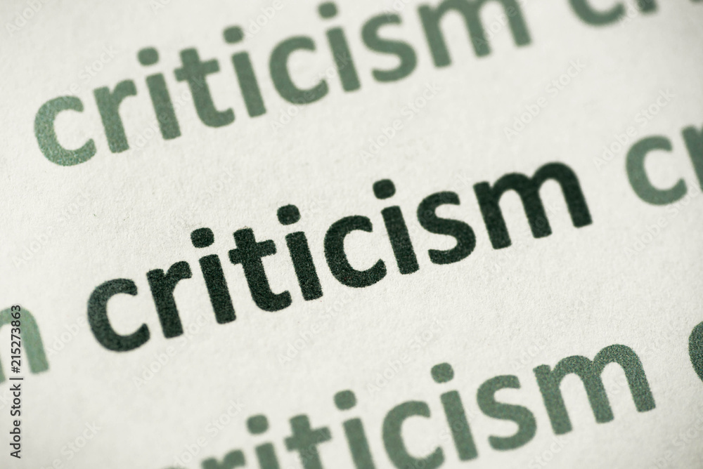 word criticism printed on paper macro word criticism printed on paper macro