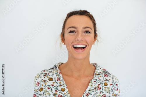 Portrait of a young smiling woman over white background.