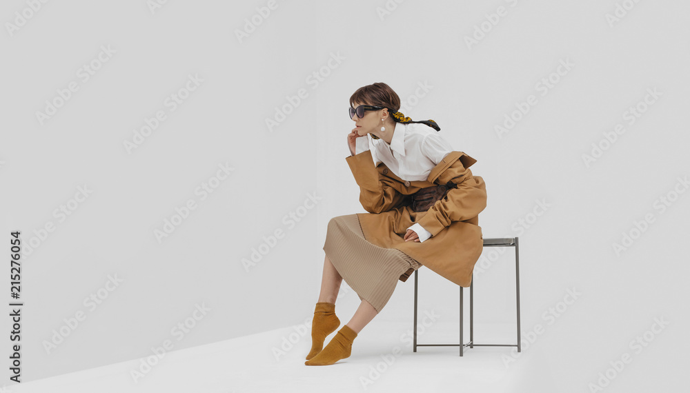 Trendy female / fashion model in abstract white space. Trendy female / fashion model in abstract white space.
