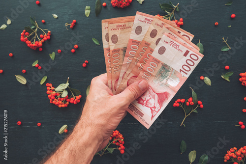 Hand holding Serbian currency thousand dinars banknotes