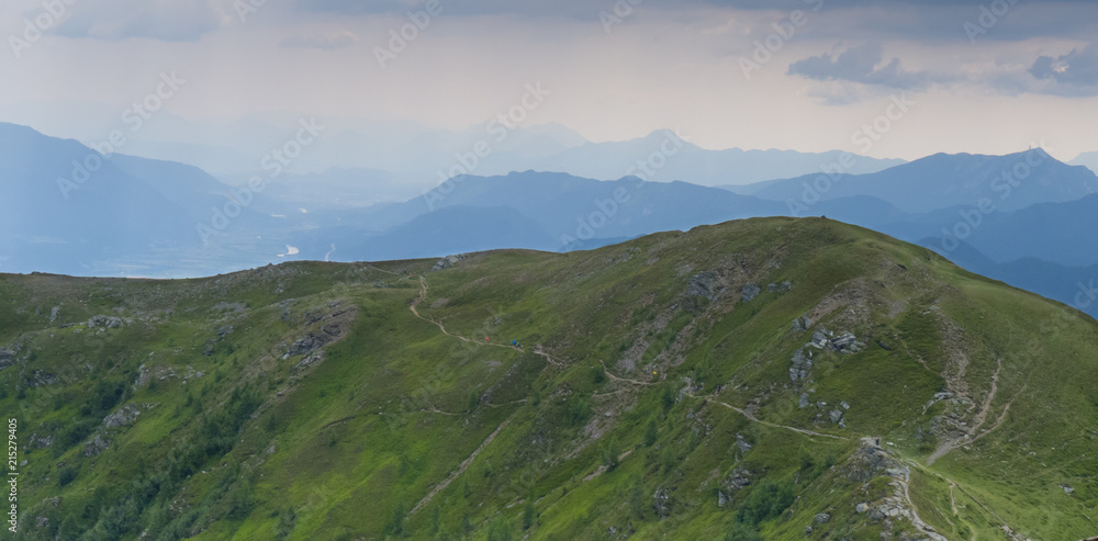 hiking path on mountain with panoramic karawanken view