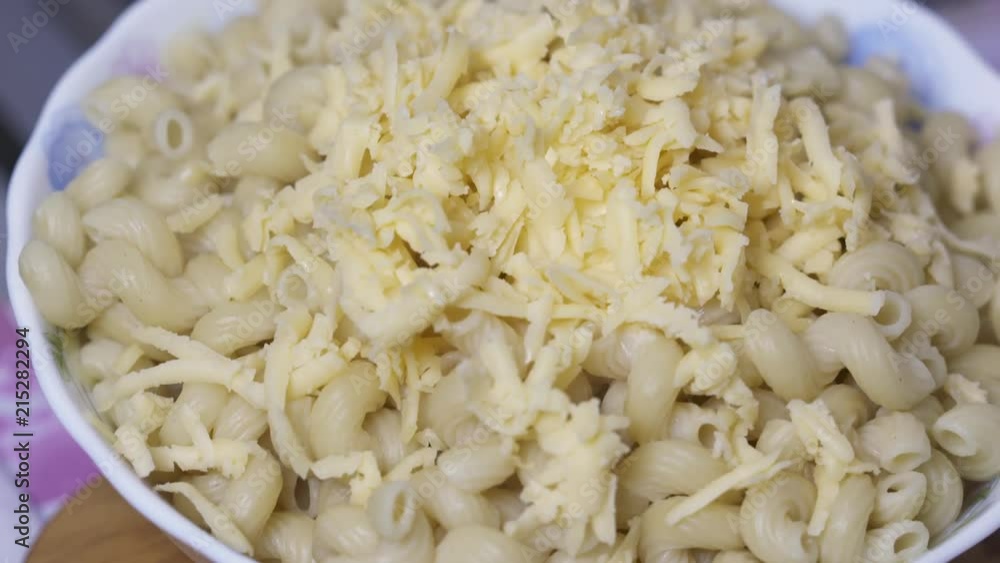 Pasta in bowl with butter and cheese Pasta in bowl with butter and cheese