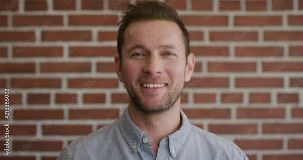 portrait happy caucasian man smiling enjoying successful lifestyle looking cheerful positive male entrepreneur slow motion portrait happy caucasian man smiling enjoying successful lifestyle looking cheerful positive male entrepreneur slow motion