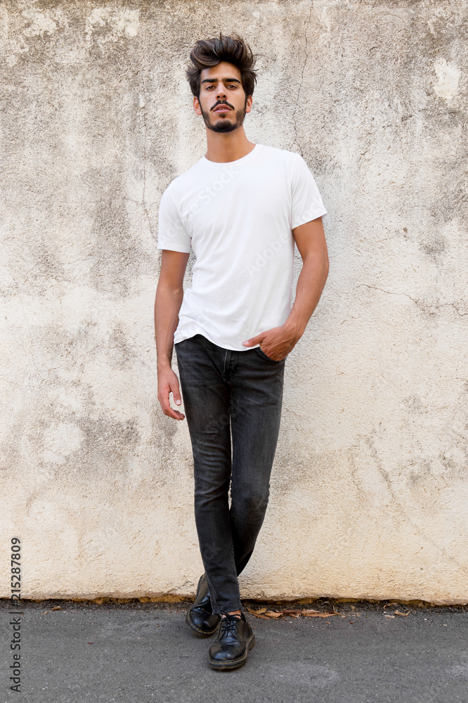 Portrait of a handsome young man with goatee looking at camera Portrait of a handsome young man with goatee looking at camera