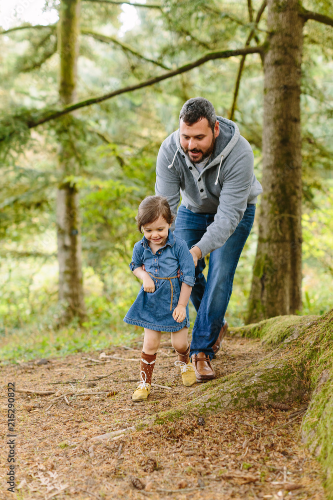 Dad Playing with Daughter Running in Forest Dad Playing with Daughter Running in Forest
