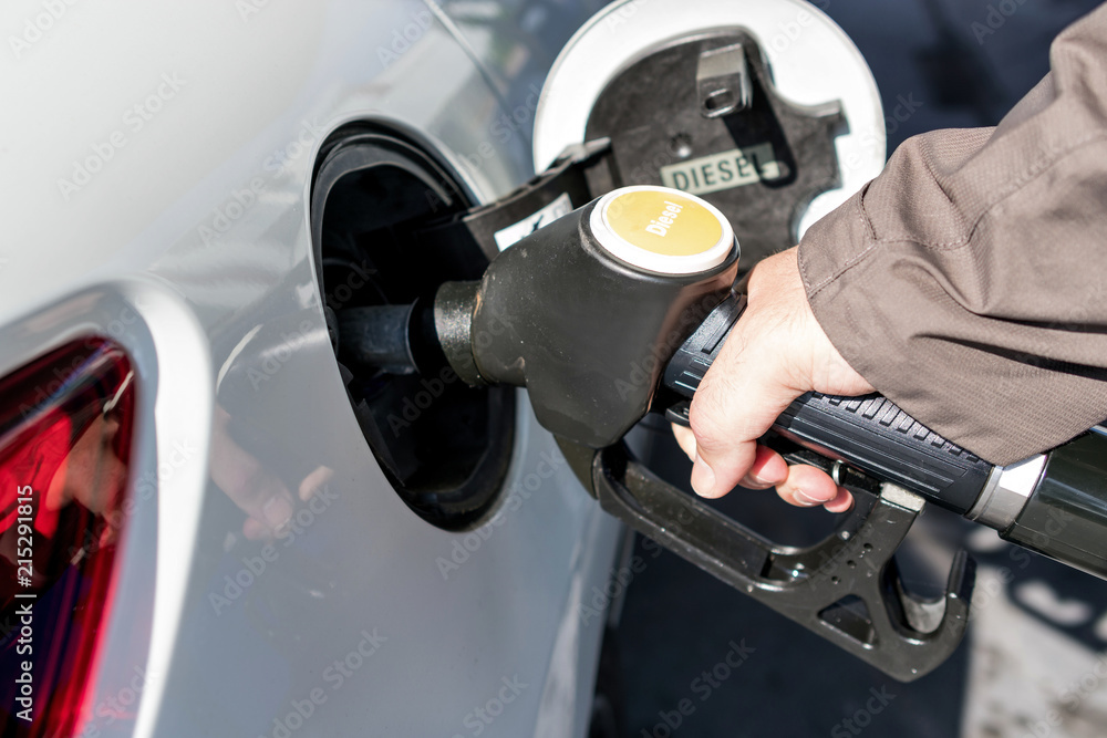 car refueling diesel pump at petrol station car refueling diesel pump at petrol station