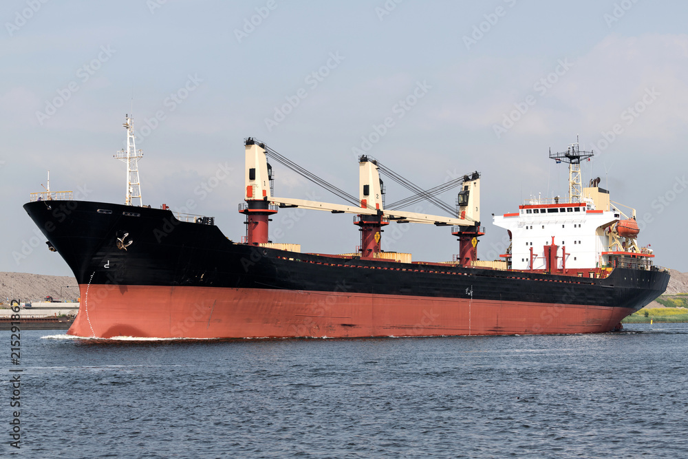 general cargo vessel shipping on canal