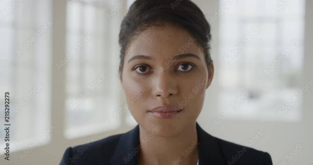 close up portrait of young mixed race woman looking serious at camera successful lifestyle positive independent female close up portrait of young mixed race woman looking serious at camera successful lifestyle positive independent female