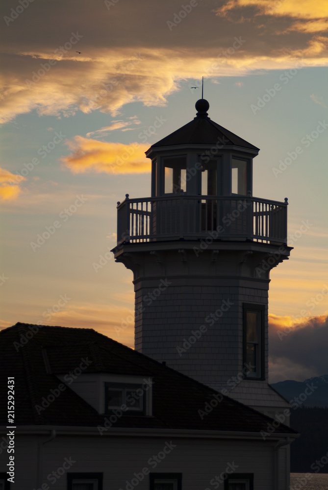 Lighthouse Overlooking City of Port Townsend, Washington at Sunset. Historic Port Townsend sits on the entrance to the Puget Sound area. Victorian houses are plentiful in this old seaport town. 