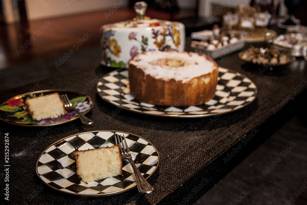 slice of cake with powder sugar on top on a dark wood background. selective focus slice of cake with powder sugar on top on a dark wood background. selective focus