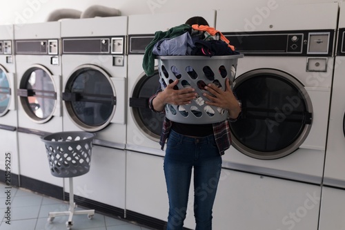 Woman carrying laundry basket