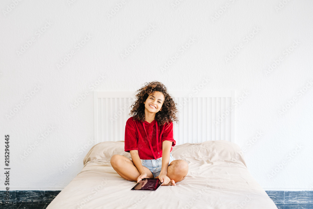 Pretty young model posing on bed Pretty young model posing on bed