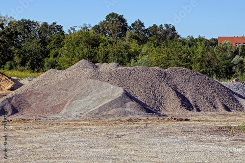 large pile of fine gray gravel on the street