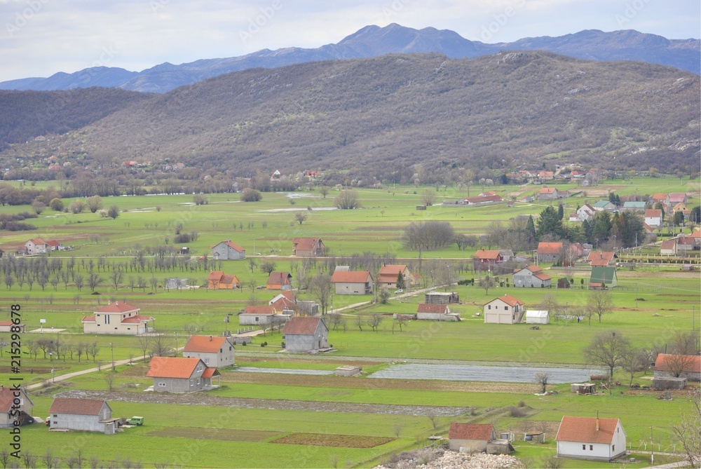 Rural landscape of Niksic, Montenegro. Village houses in the fields.