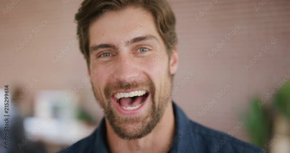 close up portrait of attractive young man laughing happy entrepreneur enjoying success slow motion close up portrait of attractive young man laughing happy entrepreneur enjoying success slow motion