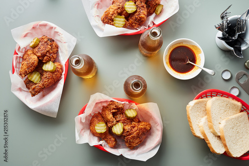 Delicious deepfried chicken served with beer and hot sauce. photo