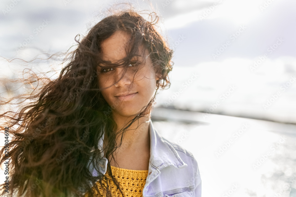 Young woman tousled by the wind Young woman tousled by the wind