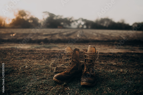 A pair of boots in a field of cultivation